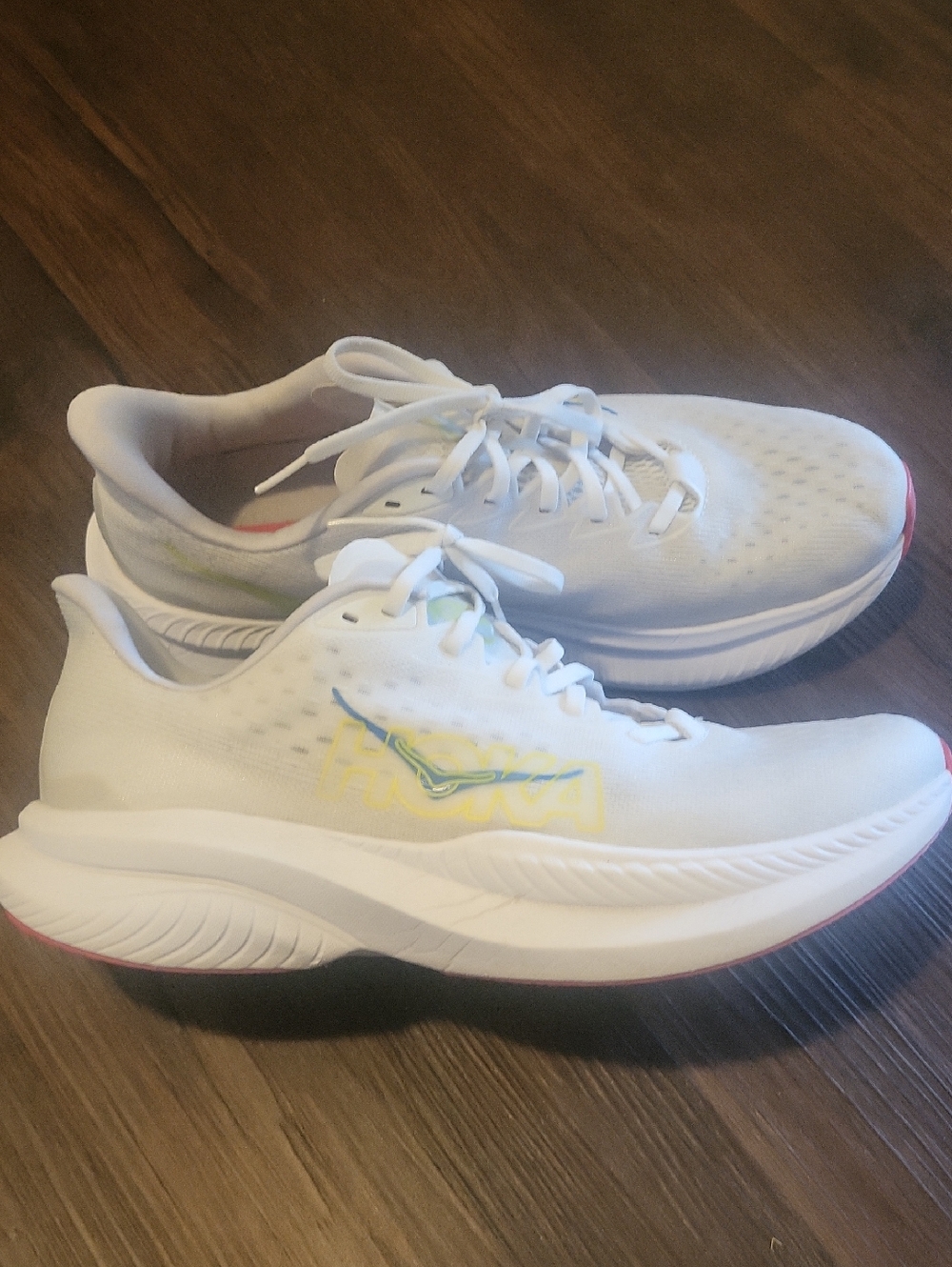 Hoka White Sneakers with Yellow Logo and Pink Sole Trim